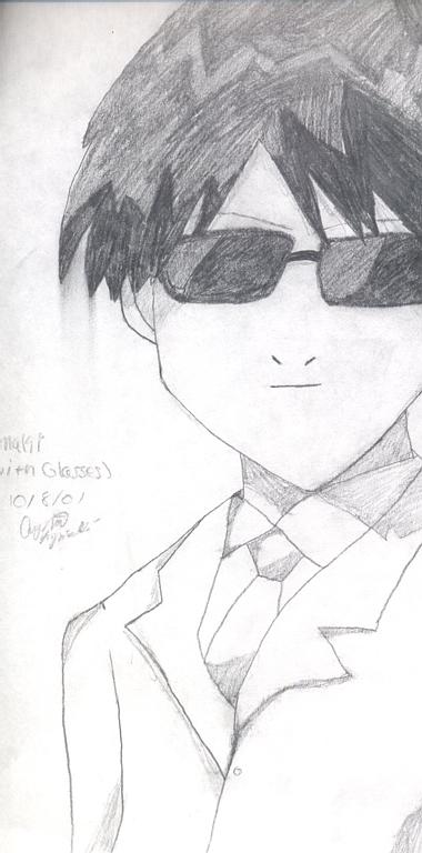 Yamaki in suit with glasses